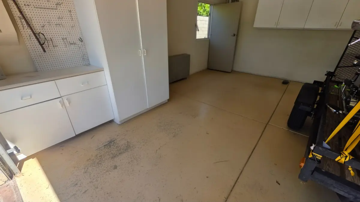 The same Avondale garage swept clear with the cabinets and door visible