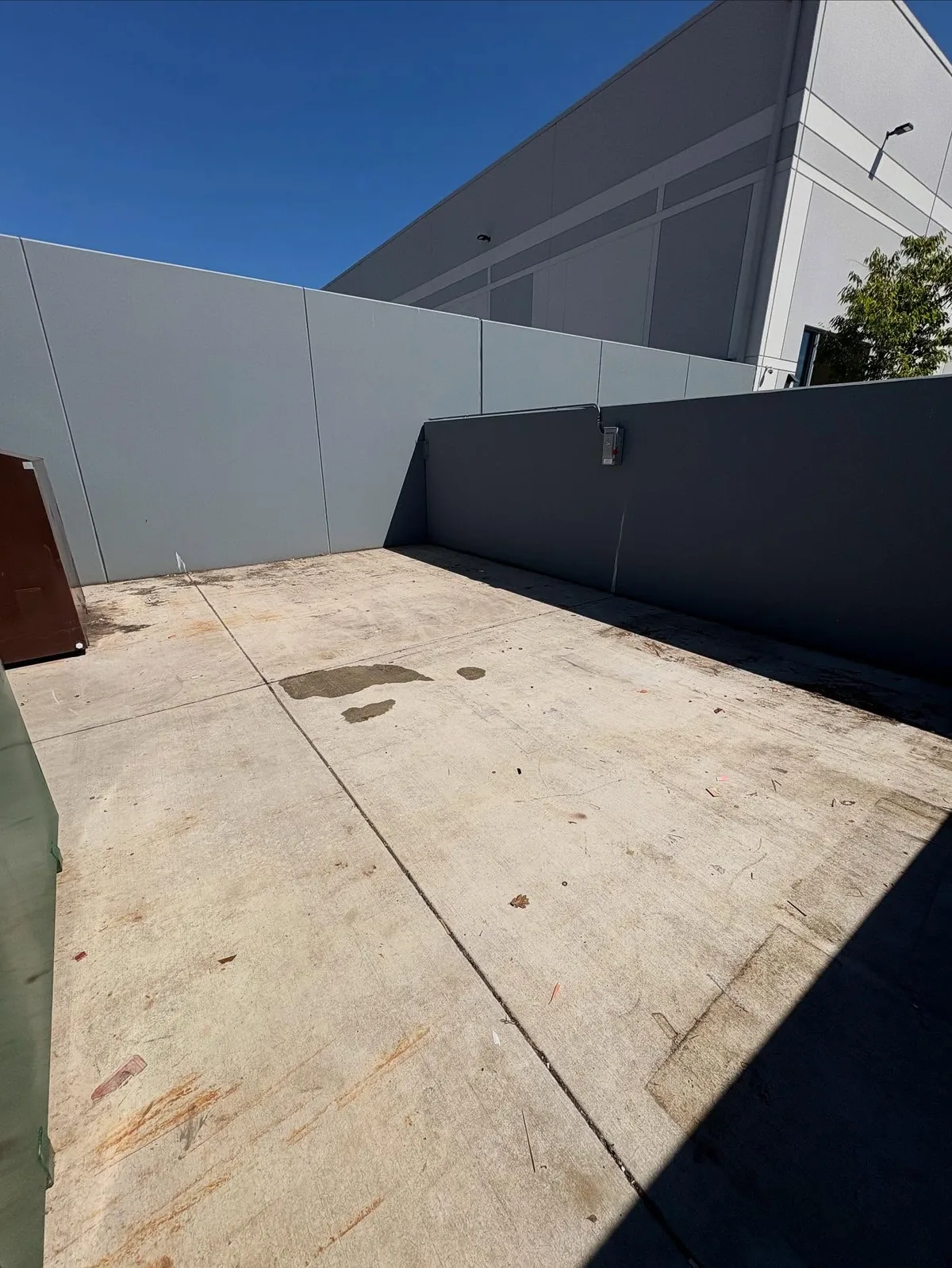 Cleared outdoor storage area after junk removal at a Chandler commercial property