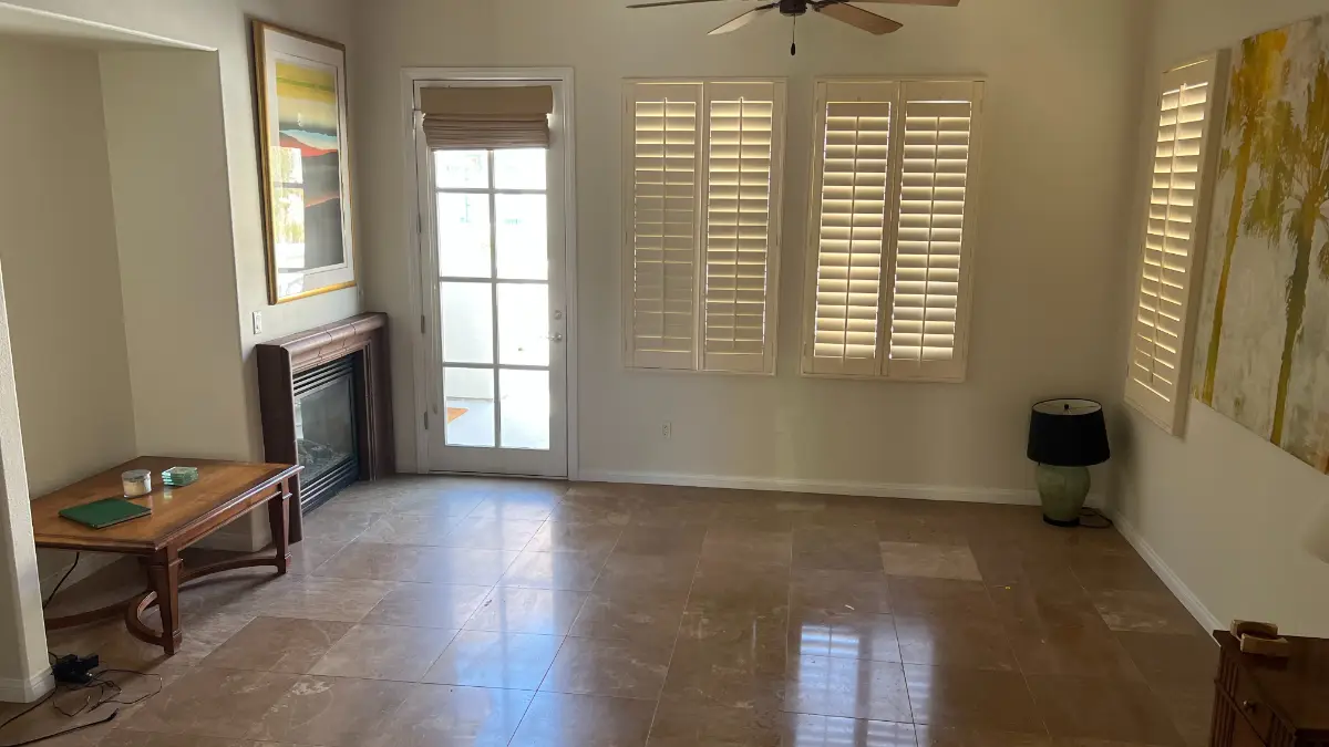 The same Fountain Hills living room cleared to the travertine floor