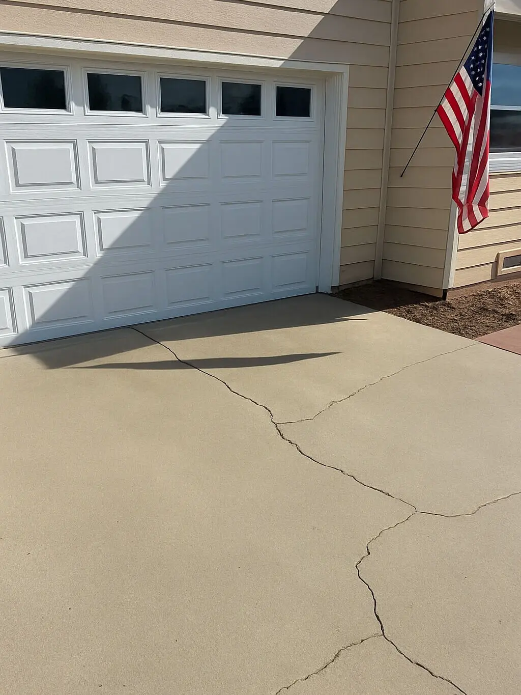 The same Gilbert driveway clear in front of the garage door