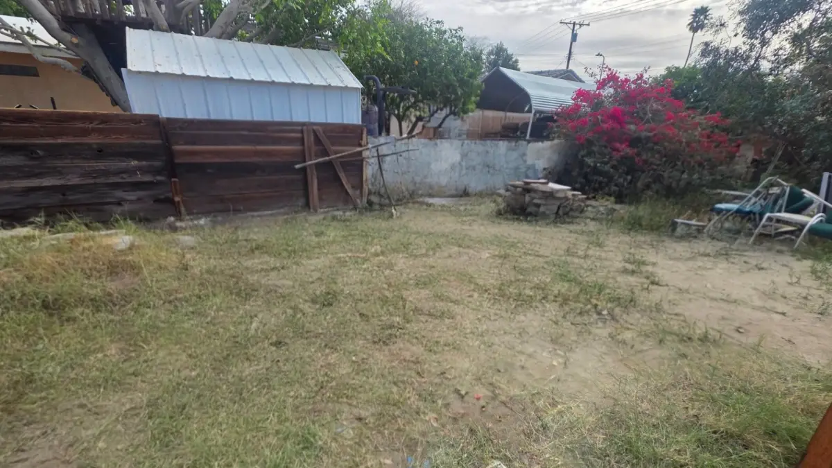 The same Goodyear backyard clear along the fence