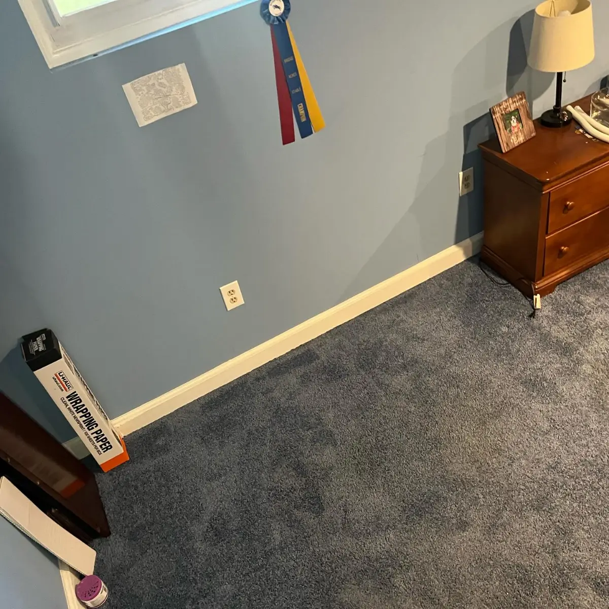 The same Mesa bedroom wall with the sectional gone; the TV, wall art and lamp remain
