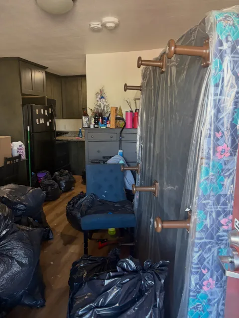 Kitchen and entry of a Mesa apartment before an estate cleanout