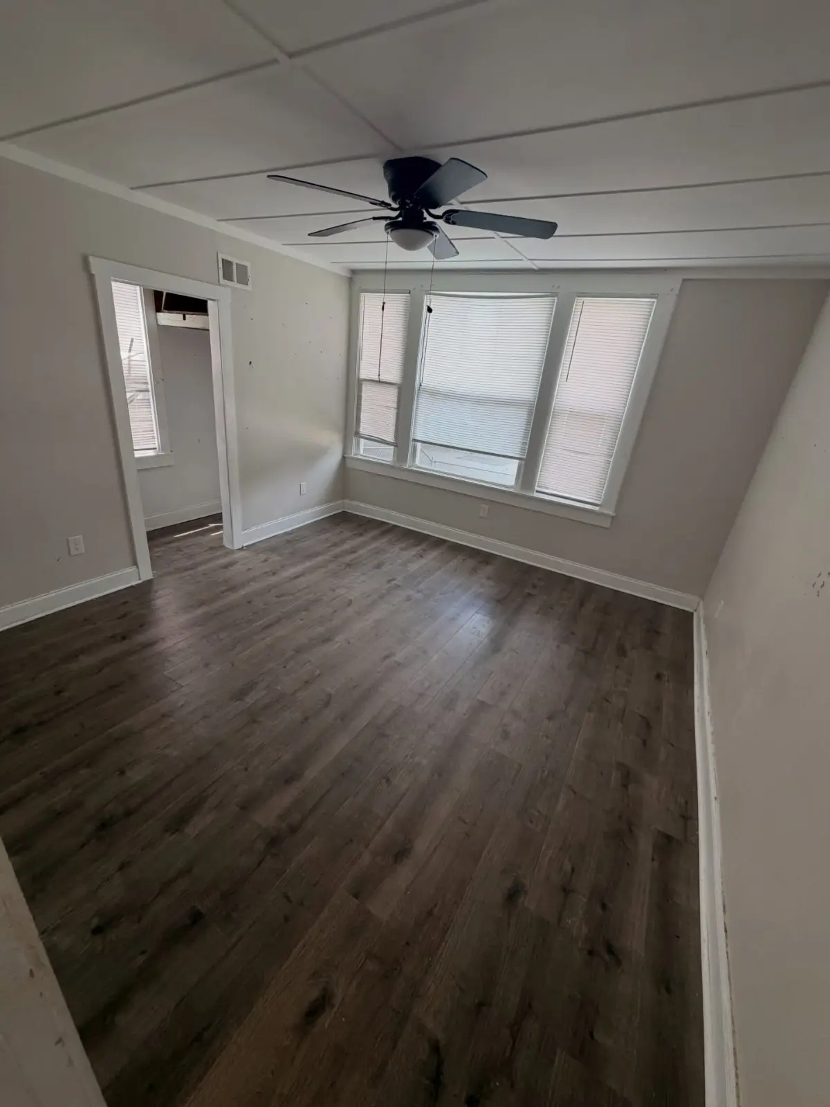 The same Mesa bedroom emptied after the cleanout, with the furniture and floor contents removed