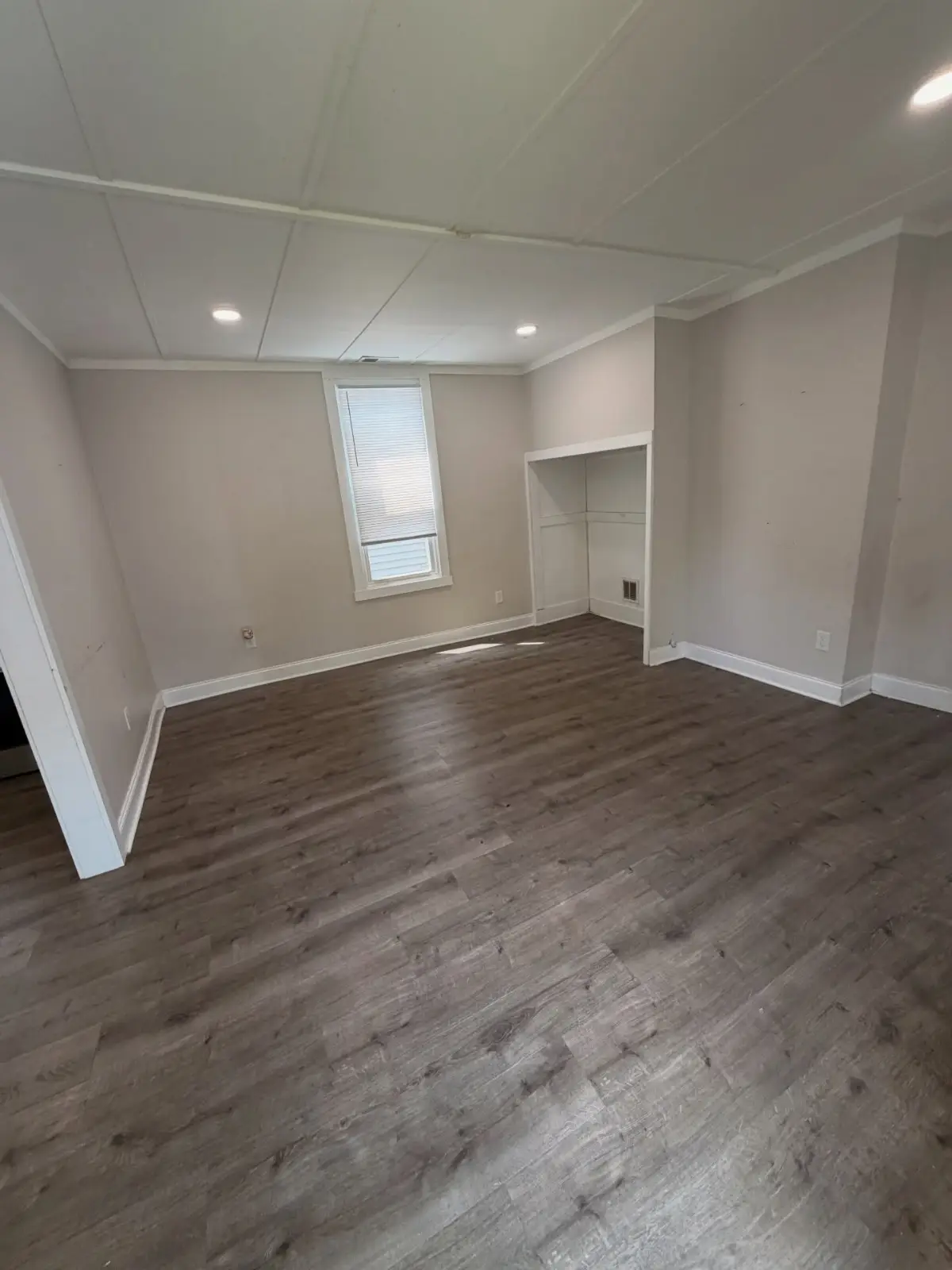 The same Mesa living room cleared, with the furniture, boxes, and loose contents removed