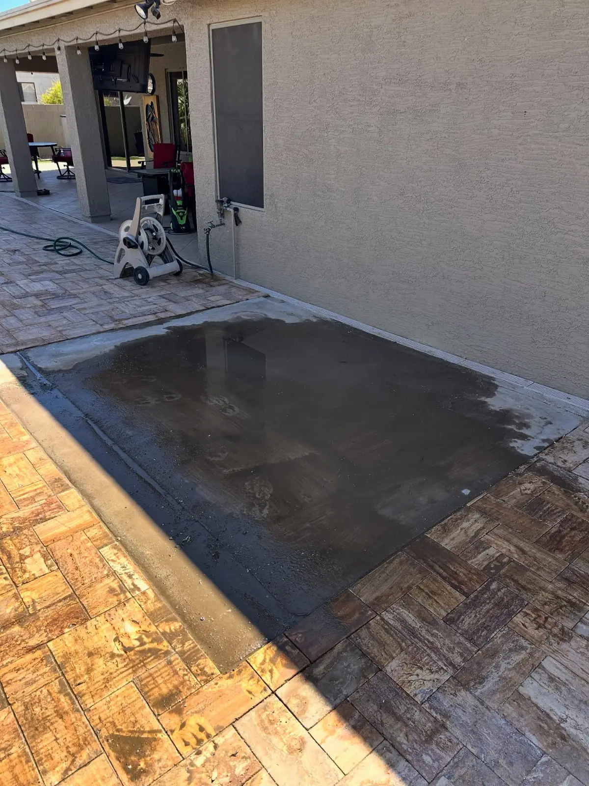The same Mesa patio with the hot tub gone and the concrete pad bare