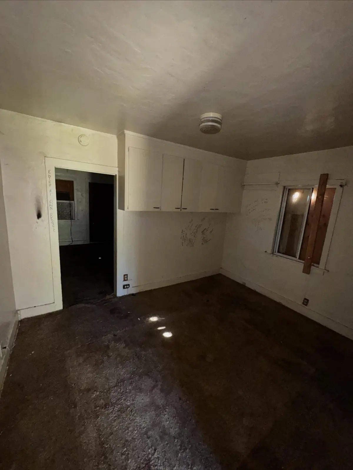 The same Mesa bedroom empty, with the built-in shelves and closet clear