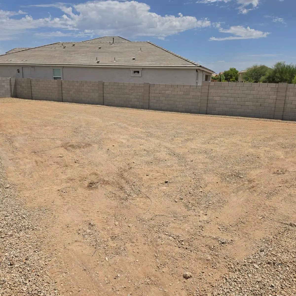 The same Mesa yard cleared to bare dirt with the tree, grasses and gravel gone