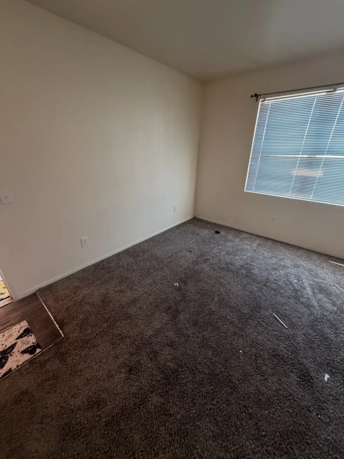 The same Peoria bedroom empty to the carpet