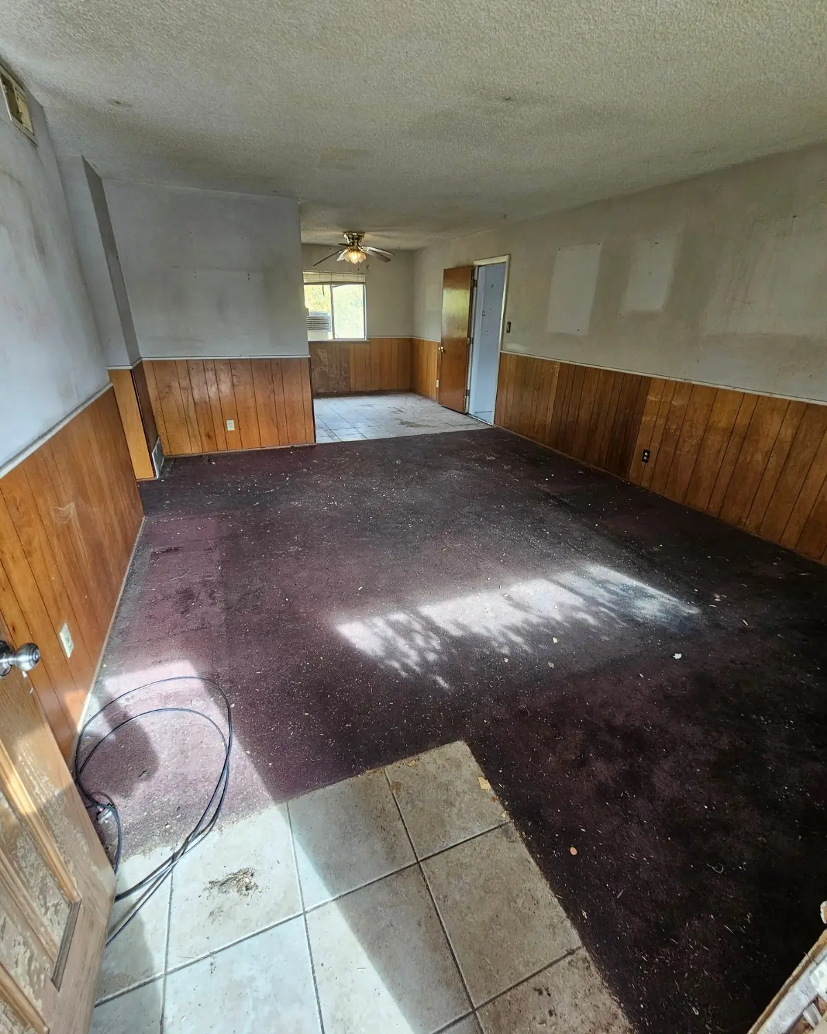 The same Phoenix living room cleared to the bare floor