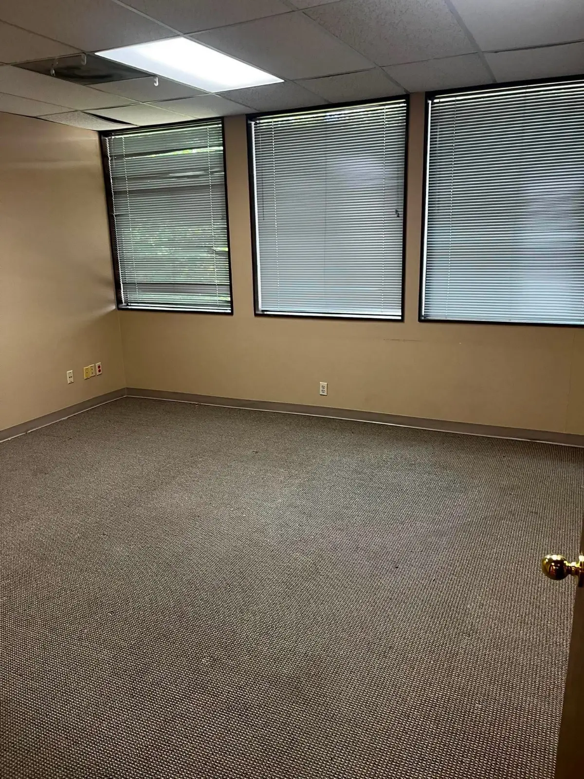 The same Scottsdale office empty to the carpet with the windows clear