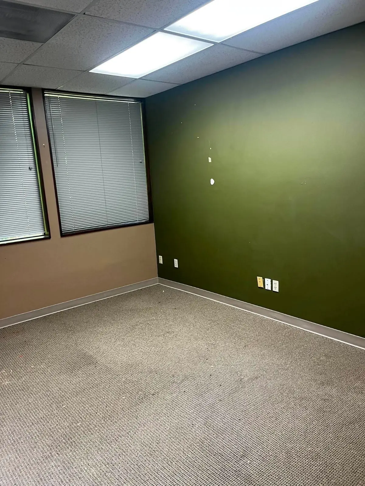 The same private office cleared to the carpet with the hutch taken down