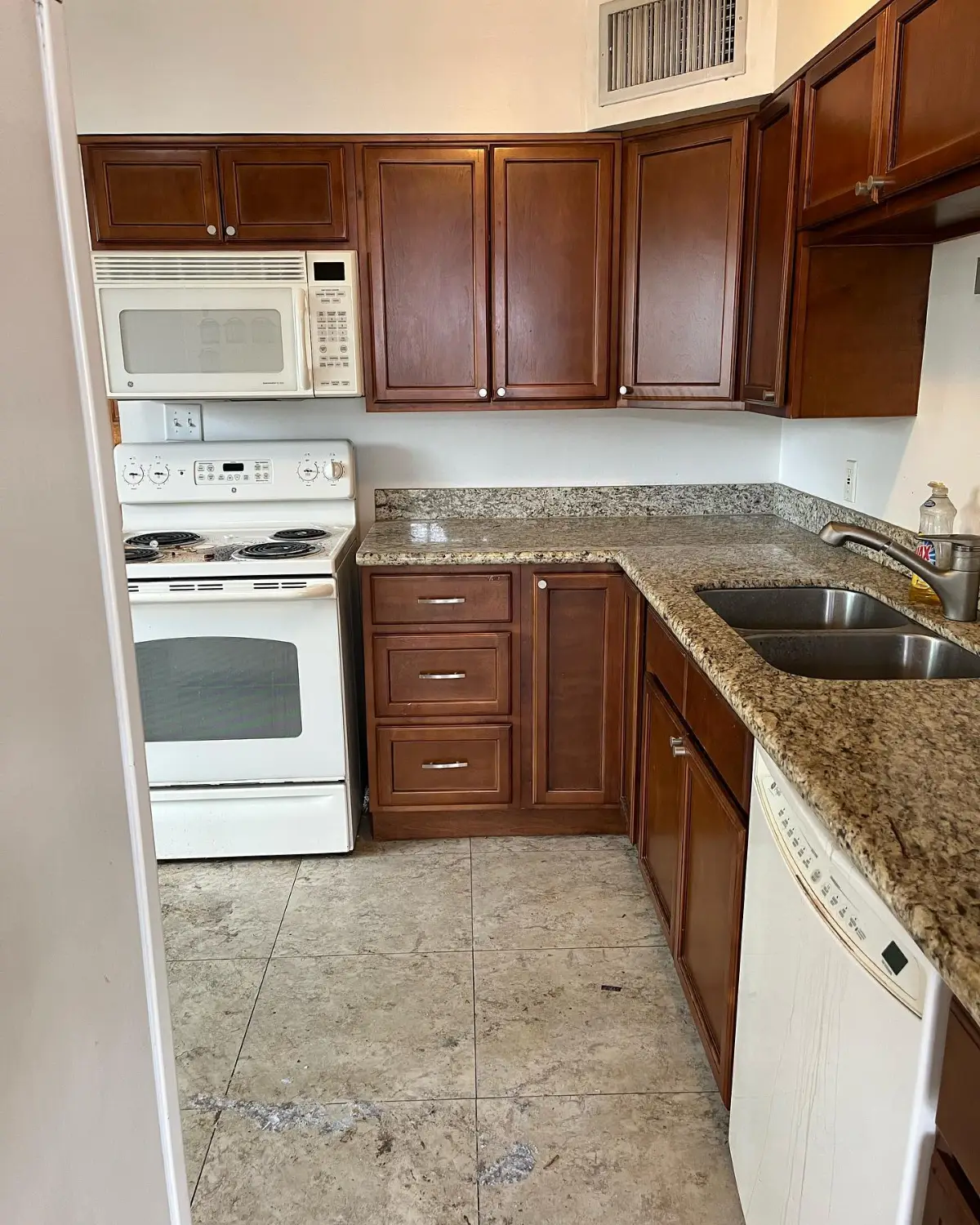 The same Scottsdale kitchen cleared with the counters and cabinets empty