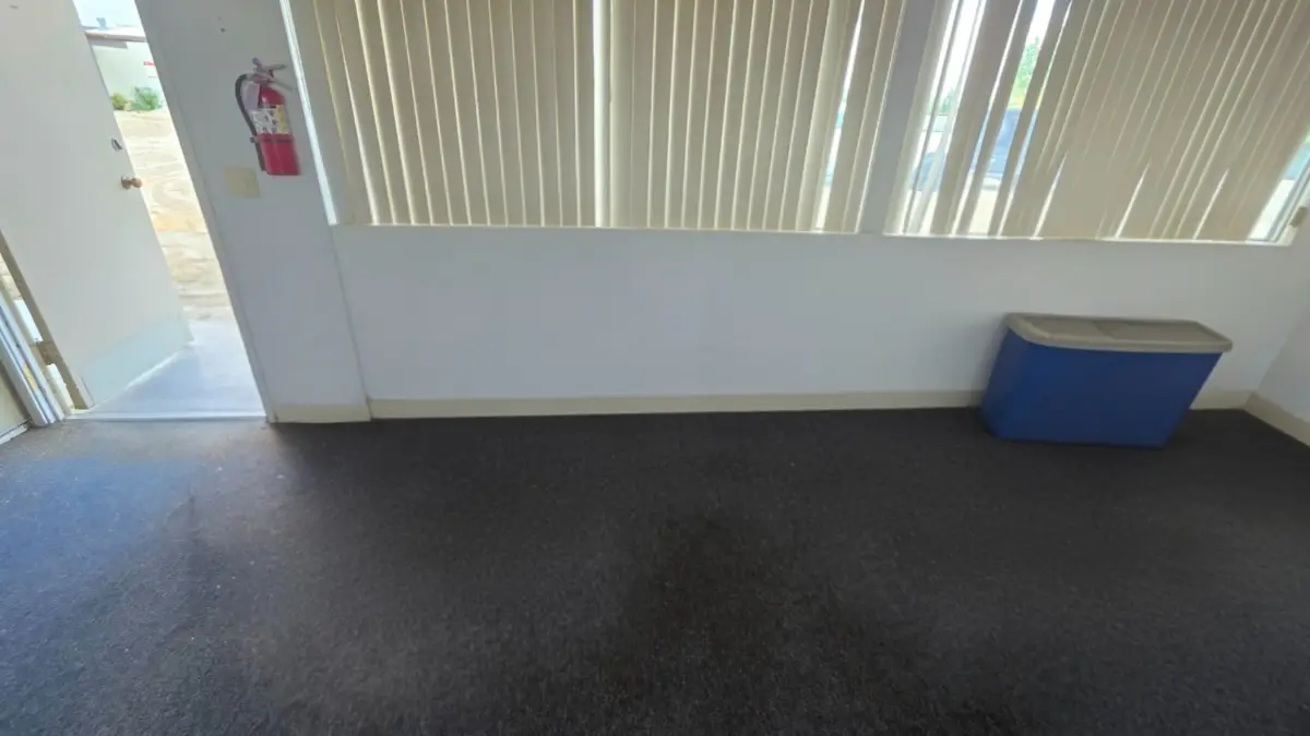 The same Sun City room with the instruments gone and the carpet clear