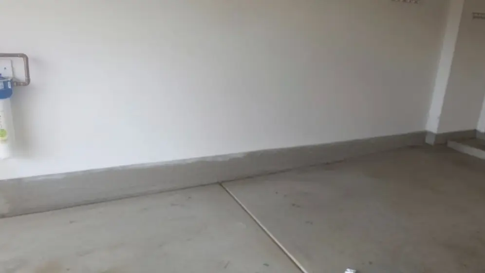 The same Tempe garage wall bare with the slab clear