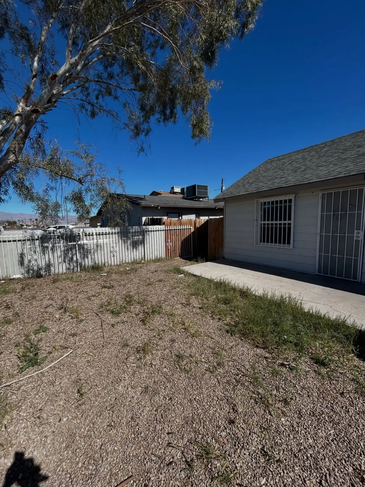 The same Tempe side yard with the mattresses and debris gone